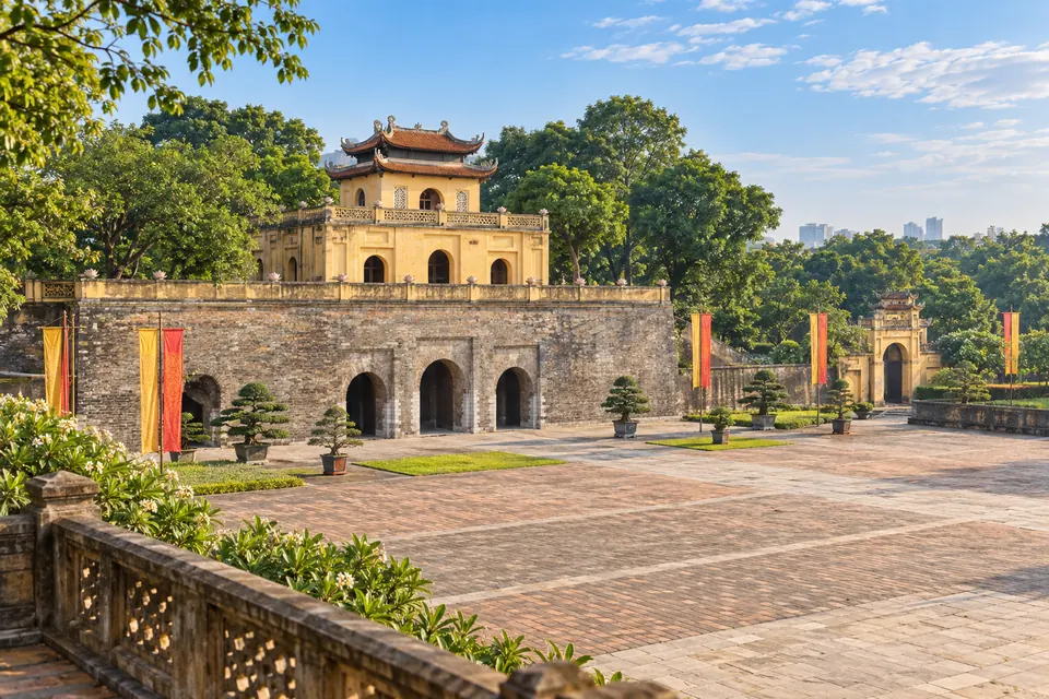 Illustrative daylight view of a historic courtyard and gate at Hanoi's Thang Long Imperial Citadel.